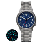 The Berny watch is equipped with a titanium bracelet and a striking blue dial. It includes luminous hands and markers for enhanced night visibility, as highlighted in the inset. This watch offers a perfect mix of style and functionality, suitable for any environment.
