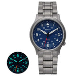 The Berny watch features a sleek titanium bracelet and a striking blue dial. It includes luminous hands and markers, ensuring visibility in low-light conditions as shown in the inset. This watch blends elegant style with practical functionality, suitable for any occasion.