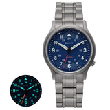 The Berny watch features a sleek titanium bracelet and a striking blue dial. It includes luminous hands and markers, ensuring visibility in low-light conditions as shown in the inset. This watch blends elegant style with practical functionality, suitable for any occasion.